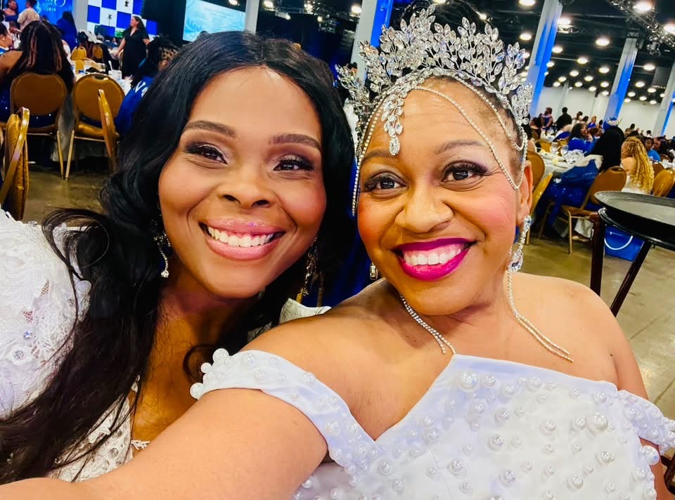 Latoya Jeeter smiling with a soror crowned at a Zeta Phi Beta celebration