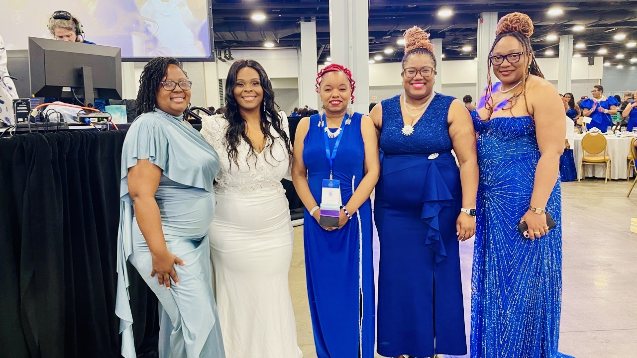 Latoya Jeeter with four sorors in formal attire at an international gathering