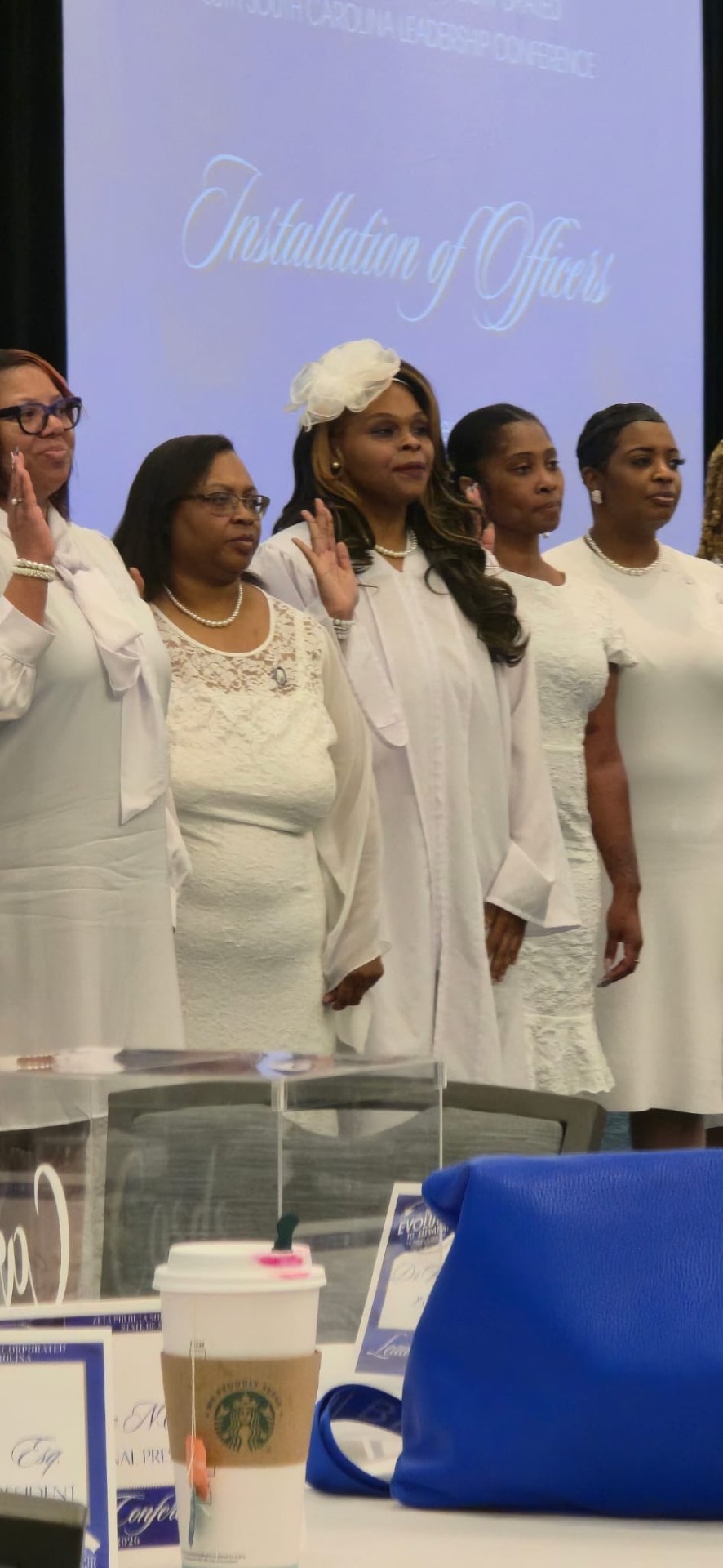 Officers with right hands raised during the installation of officers at the South Carolina Leadership Conference